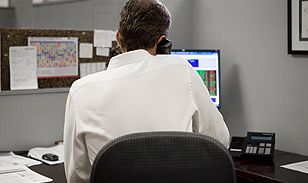 man computer behind photo